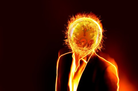 man with head on fire from work fatigue