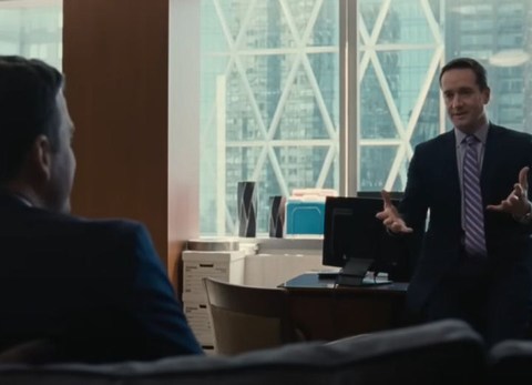 two men in tense work meeting